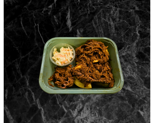 Home made Pulled Beef brisket on a baked potato with coleslaw